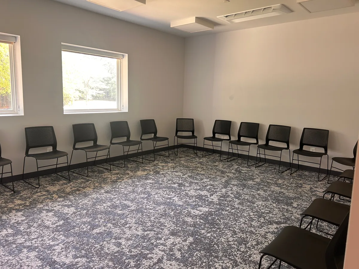 Group therapy room with chairs along the walls at Still Detox New Jersey