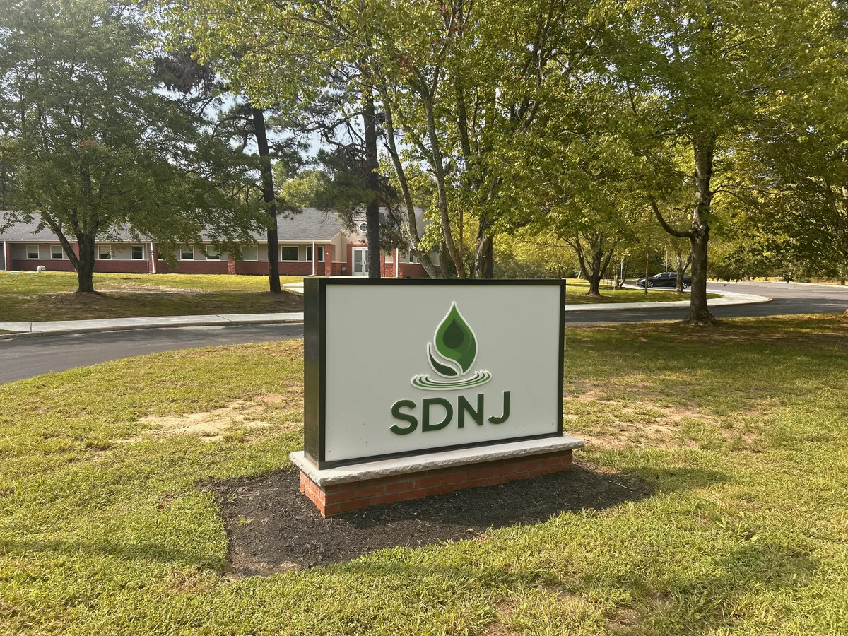 SDNJ monument sign at the Route 50 entrance to Still Detox New Jersey in Mays Landing