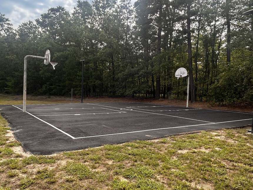 Outdoor basketball court in the woods on the Still Detox New Jersey campus