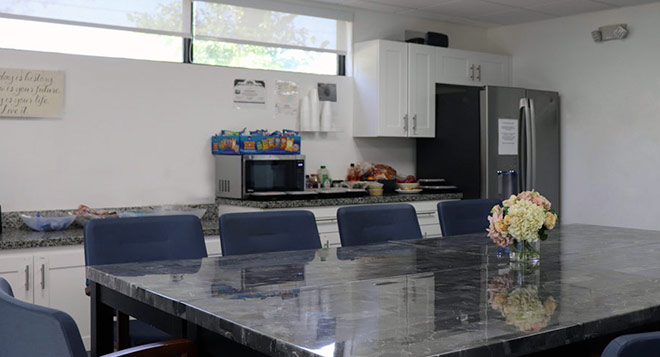 Open kitchen and dining area inside the Still Detox Boca Raton facility