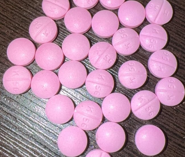 k56 pink round pill